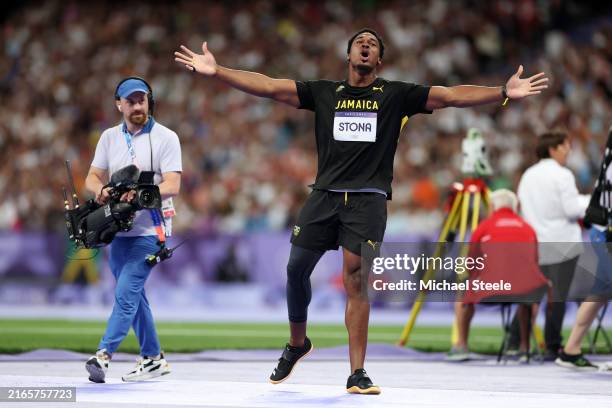 Roje Stona of Team Jamaica celebrates after breaking the Olympic record during the Men's Discus Throw final on day twelve of the Olympic Games Paris...