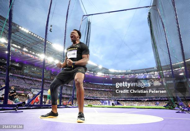 Roje Stona of Team Jamaica celebrates after breaking the Olympic record during the Men's Discus Throw final on day twelve of the Olympic Games Paris...