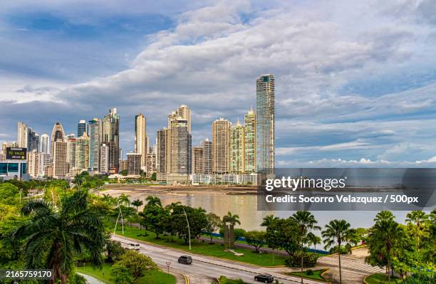 view of buildings against cloudy sky,panama city,panama - panamá fotografías e imágenes de stock