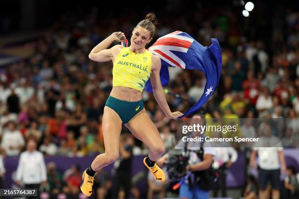Nina Kennedy of Team Australia celebrates winning the gold medal after competing in the Women's Pole Vault Final on day twelve of the Olympic Games...
