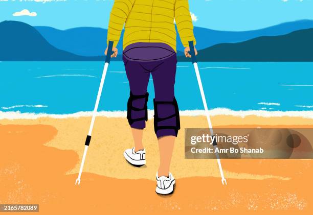 a person with a knee brace walking along a sandy beach with the aid of crutches against a backdrop of tranquil blue water and mountains - knee brace stock illustrations