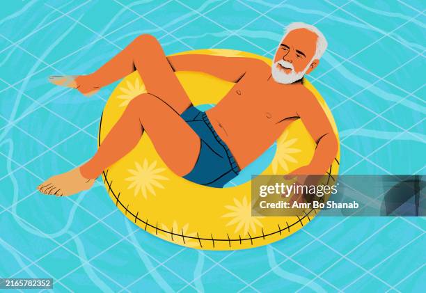 an elder man with a white beard enjoys floating on a yellow inner tube in a pool, with a relaxed pose and a happy expression - happy retirement stock illustrations