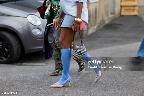 Guest wears Miu Miu bag outside Baum & Pferdgarten during day three of the Copenhagen Fashion Week SS25 on August 07, 2024 in Copenhagen, Denmark.