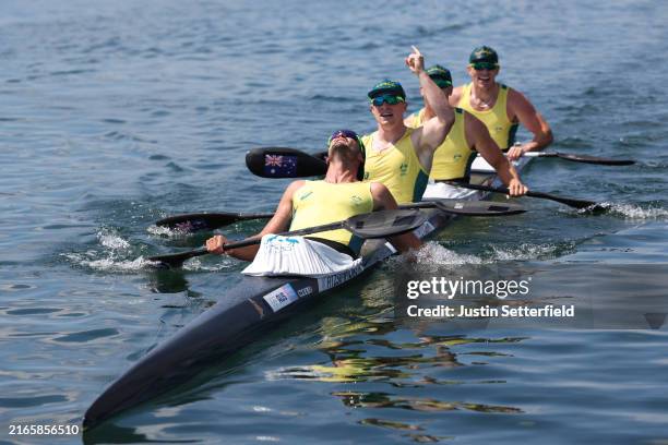 Silver medalists Riley Fitzsimmons, Pierre van der Westhuyzen, Jackson Collins and Noah Havard of Team Australia celebrate following the Men's Kayak...
