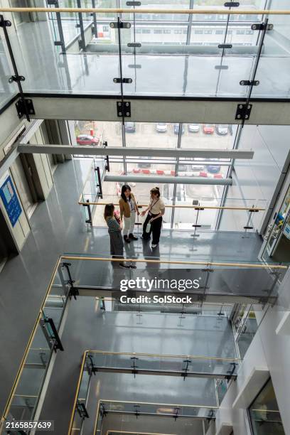corridor conversations - education building stock pictures, royalty-free photos & images