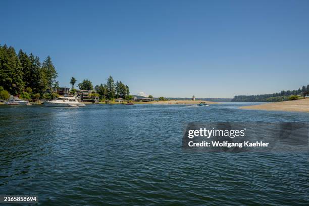 View of the entrance to the bay of Gig Harbor, a natural harbor, with marinas and boats at the city of Gig Harbor, Pierce County, Washington State,...