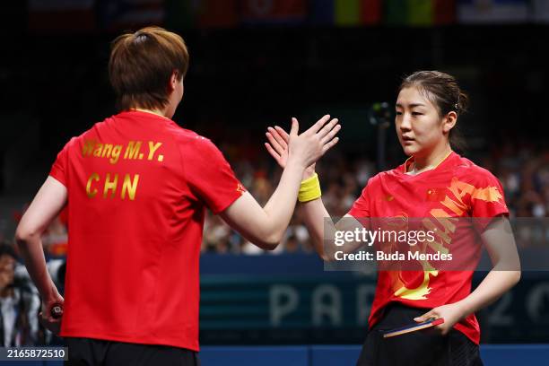 Meng Chen and Manyu Wang of Team People's Republic of China celebrate victory in Match 1 against Yubin Shin and Jihee Jeon of Team Republic of Korea...