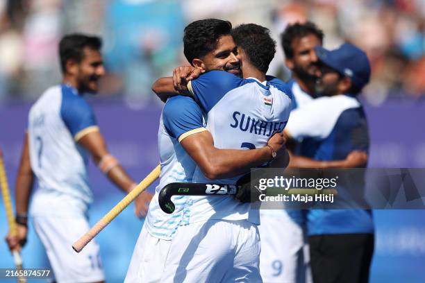 Abhishek Abhishek and Sukhjeet Singh of Team India celebrate victory in the Men's Bronze Medal match between India and Spain on day thirteen of the...