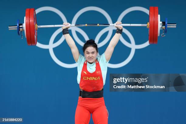 Shifang Luo of Team People's Republic of China performs a Clean & Jerk to set new Olympic Record of 134kg during the Weightlifting Women's 59kg on...