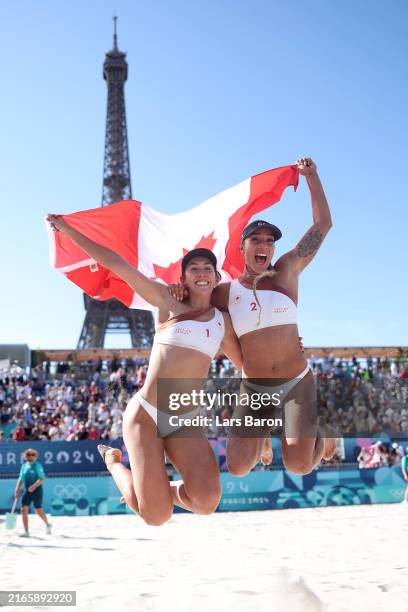 Melissa Humana-Paredes and Brandie Wilkerson of Team Canada celebrate after defeating Tanja Hueberli and Nina Brunner of Team Switzerland during the...