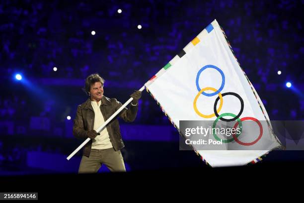 Actor Tom Cruise holds the Olympic flag during the Closing Ceremony of the Olympic Games Paris 2024 at Stade de France on August 11, 2024 in Paris,...