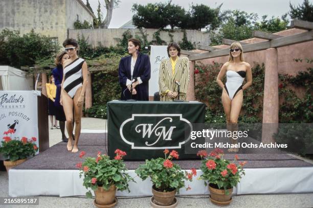 Fashion designer Alix de la Comble, wearing a dark blue coat over a white outfit with brass buttons, and Monegasque Royal Princess Stephanie of...