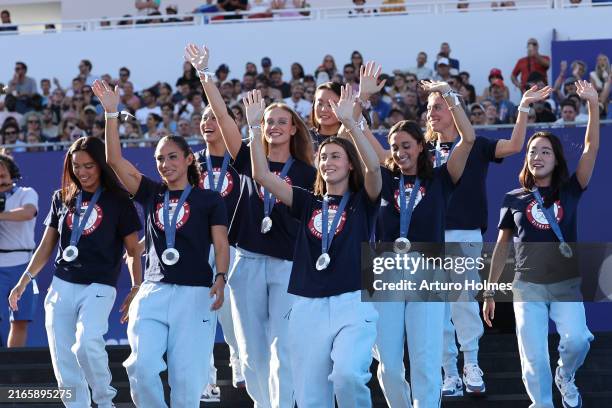 Team United States Artistic Swimming silver medalists walk the stage on day thirteen of the Olympic Games Paris 2024 at Champions Park on August 08,...