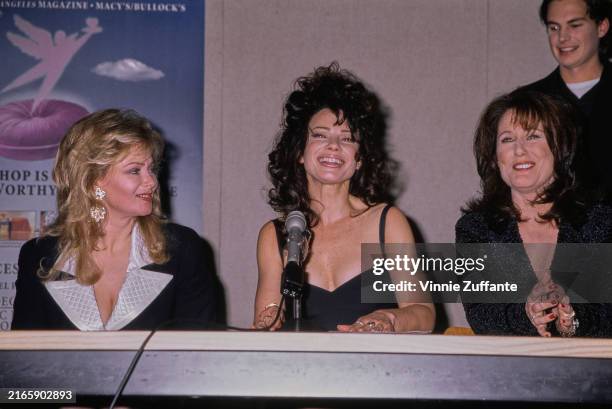 American actress Jean Smart, wearing a black outfit with white quilted lapels, American actress Fran Drescher, who wears a black outfit, and American...