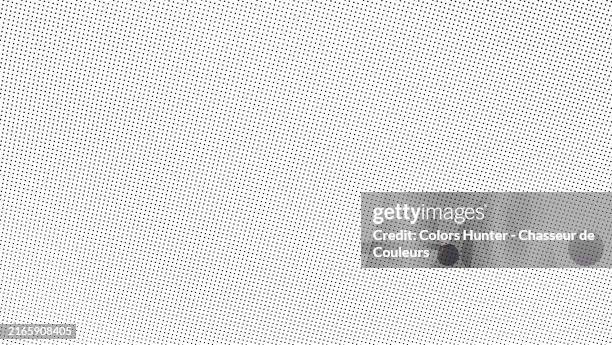small black dots on a white background. black and white macro photography of an offset printed poster in paris, france. natural light. full frame 16x9. - poster printing stock pictures, royalty-free photos & images