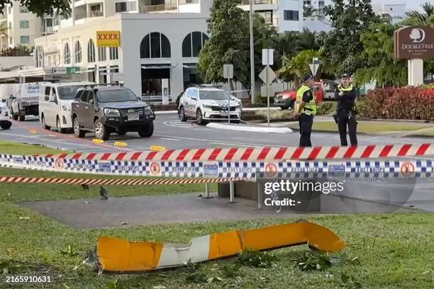 This frame grab taken from video footage provided by Australian Broadcasting Corporation on August 12 via AFPTV shows a piece of the helicopter lying...