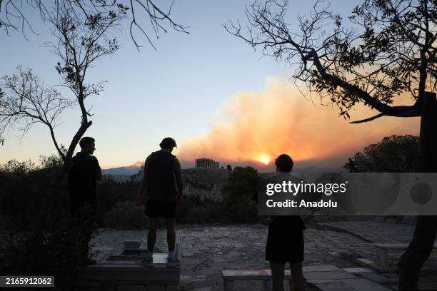 Smoke rises over Parthenon temple during a wildfire near Athens, Greece, on August 12, 2024.