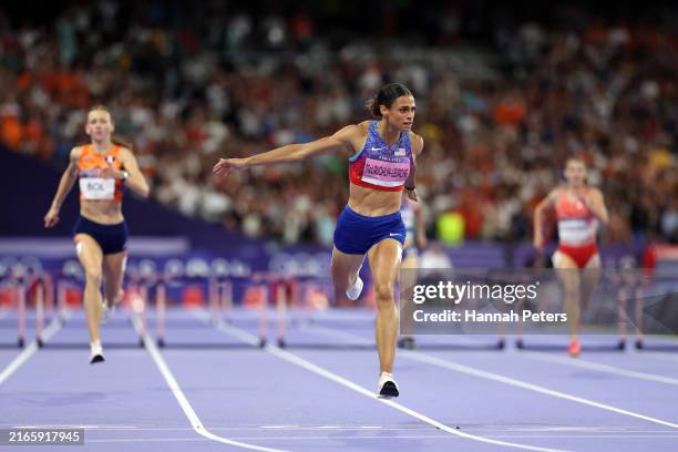 Sydney McLaughlin-Levrone of Team United States crosses the finish line to win the gold medal after competing in the Women's 400m Hurdles Final on...