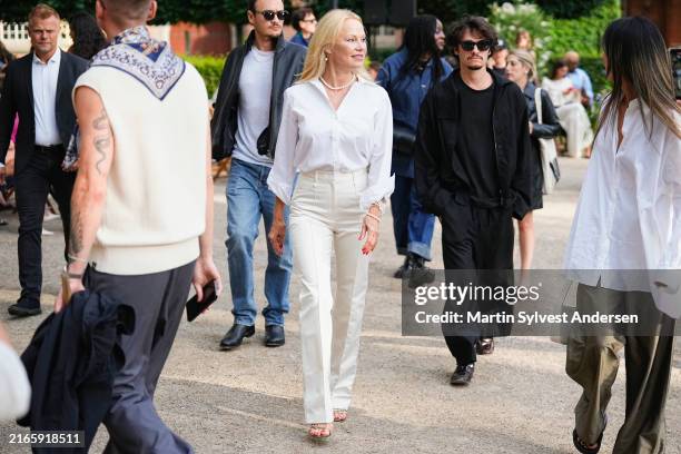 Dylan Lee Jagger, Pamela Anderson and Brandon Thomas Lee attend the ROTATE show during Copenhagen Fashion Week on August 08, 2024 in Copenhagen,...