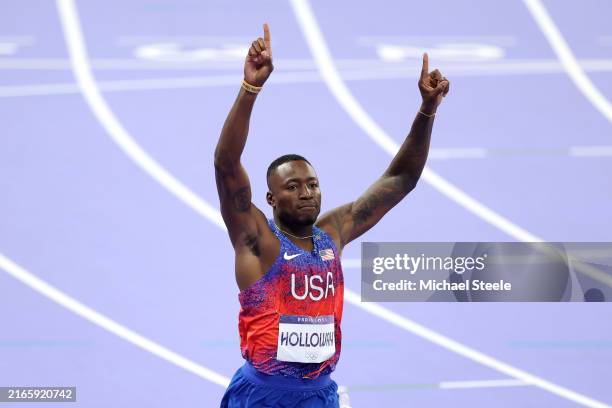 Grant Holloway of Team United States celebrates after winning the gold medal after competing in Men's 110m Hurdles on day thirteen of the Olympic...