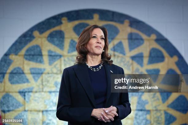 Democratic presidential candidate U.S. Vice President Kamala Harris waits to speak at a campaign rally at United Auto Workers Local 900 on August 8,...
