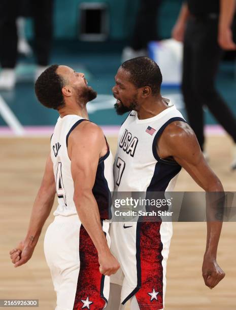 Stephen Curry and Kevin Durant of Team United States celebrate after a basket during a Men's basketball semifinals match between Team United States...