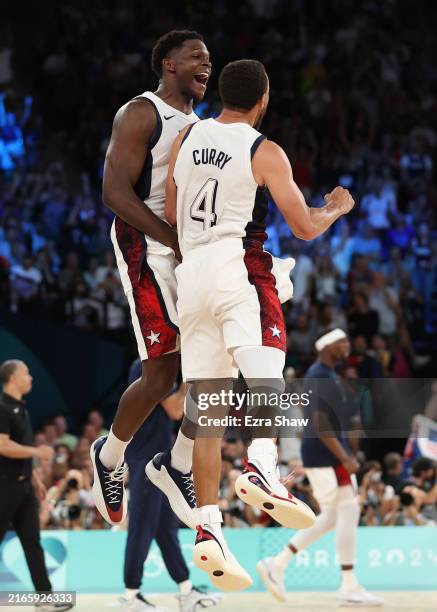 Stephen Curry and Anthony Edwards of Team United States celebrate after a basket during a Men's basketball semifinals match between Team United...