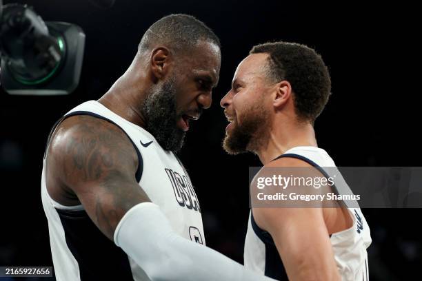 LeBron James and Stephen Curry of Team United States celebrate after their team's win against Team Serbia during a Men's basketball semifinals match...