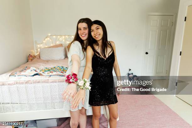portrait of smiling teenagers showing corsages - school dance stock pictures, royalty-free photos & images