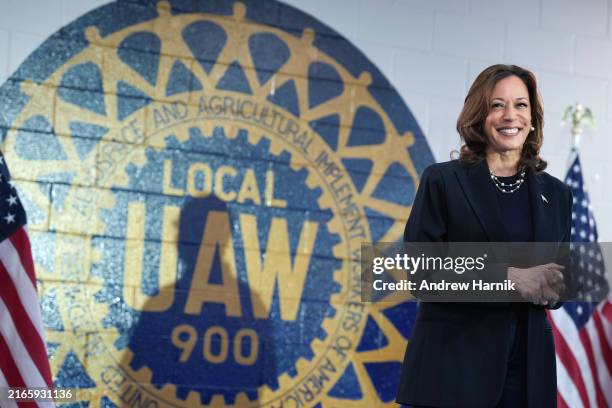 Democratic presidential candidate U.S. Vice President Kamala Harris waits to speak at a campaign rally at United Auto Workers Local 900 on August 8,...