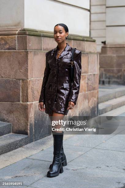 Amaka Hamelijnck wears brown sequined jacket, bag, boots outside Rotate during day four of the Copenhagen Fashion Week SS25 on August 08, 2024 in...
