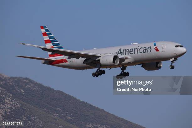 American Airlines Boeing 777 passenger aircraft spotted on final approach flying for landing at Athens International Airport Eleftherios Venizelos at...