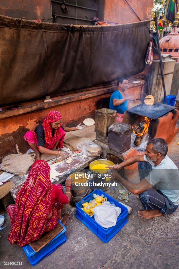 Indian street vendor preparing food - chapatti, flat bread