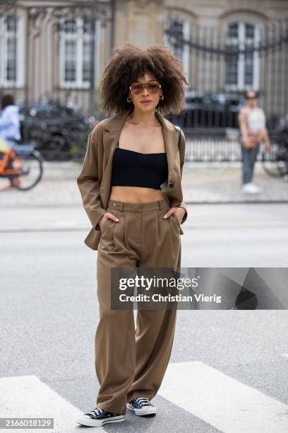 Julia Dalia wears brown blazer, pants, black topoutside Gestuz during day four of the Copenhagen Fashion Week SS25 on August 08, 2024 in Copenhagen,...