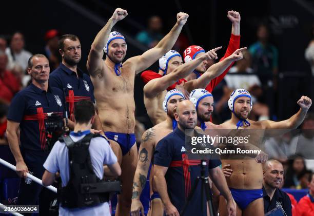 Dusan Mandic of Team Serbia celebrates with team mates after winning the Men's Semifinal match between Team Serbia and Team United States on day...