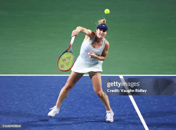 Gabriela Dabrowski of Canada hits a shot, with her teammate Erin Routliffe of New Zealand, against Caroline Dolehide of the United States and Desirae...