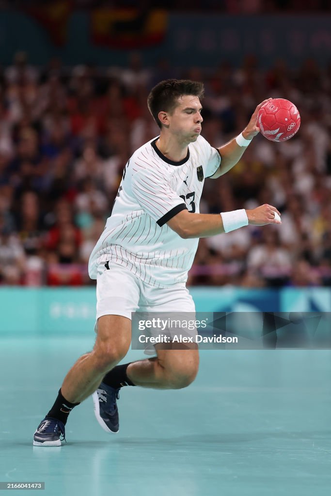 Renars Reksna Renars Uscins of Team Germany carries the ball against Team Spain ...