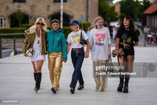 Group of guests is posing, during day four of the Copenhagen Fashion Week SS25 on August 08, 2024 in Copenhagen, Denmark.