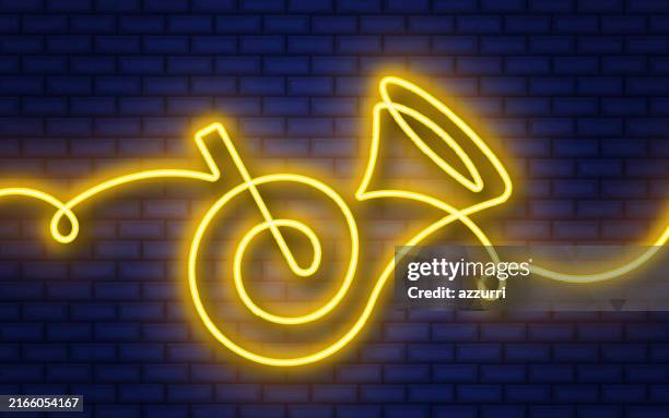 french horn continuous line neon icon isolated on brick wall background. - french horn stock illustrations