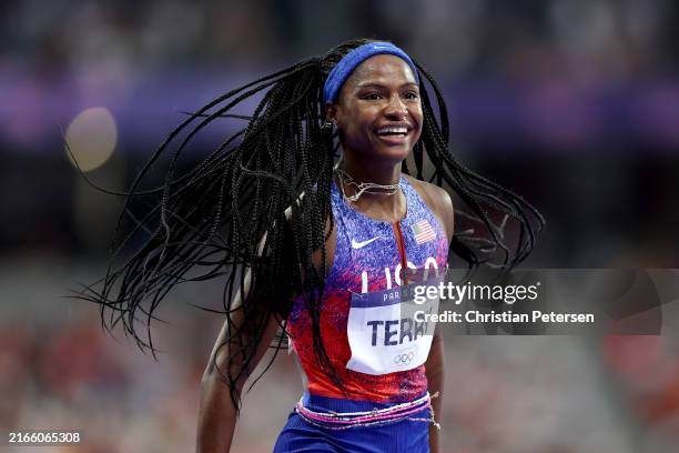 Twanisha Terry of Team United States celebrates winning the gold medal after competing in the Women's 4x100m Relay Final on day fourteen of the...