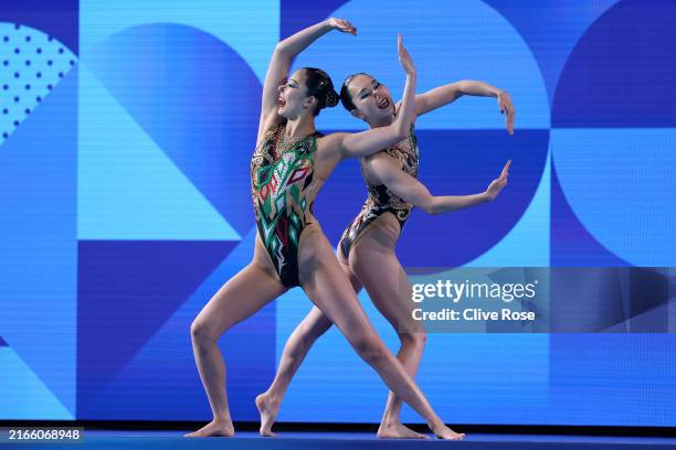 Moe Higa and Tomoka Sato of Team Japan compete in the Duet Technical Routine on day fourteen of the Olympic Games Paris 2024 at Aquatics Centre on...