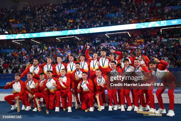 Gold medalists of Team Spain celebrate on the podium during the Men’s Football Medal Ceremony during the Olympic Games Paris 2024 at Parc des Princes...