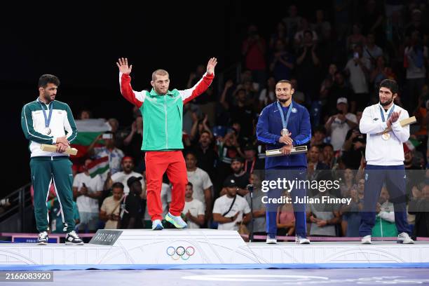 Gold medallist Magomed Eldarovitch Ramazanov of Team Bulgaria , Silver medallist Hassan Yazdanicharati and Bronze medallists Aaron Marquel Brooks of...
