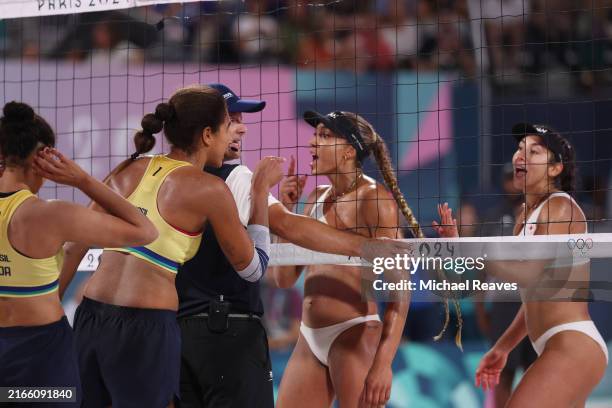 Ana Patricia Silva Ramos of Team Brazil and Brandie Wilkerson of Team Canada argue at the net during a Women's Gold Medal Match between Team Canada...