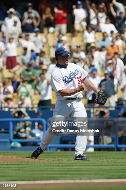 Pitcher Eric Gagne of the Los Angeles Dodgers celebrates after making the last out against the Arizona Diamondbacks for his 30th save this season in...