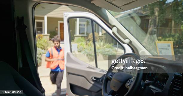 delivery person jogging towards van from suburban house - mile stock pictures, royalty-free photos & images