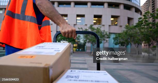 boxes on platform truck seen through truck's pov - express delivery stock pictures, royalty-free photos & images
