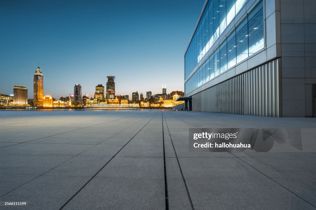 Empty floor and city building at night.