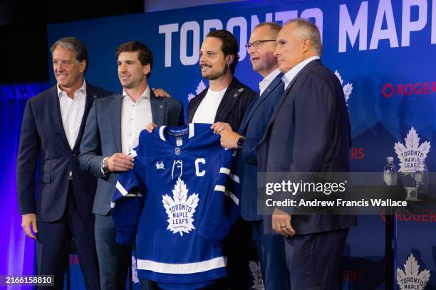 August 14 - Toronto Maple Leafs President Brendan Shanahan, left, poses with Toronto Maple Leafs players John Tavares, Auston Matthews, GM Brad...