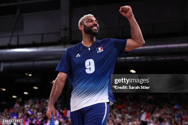 Gold medalist Earvin Ngapeth of Team France celebrates after the team's victory in the Men's Gold Medal Match between Team France and Team Poland on...